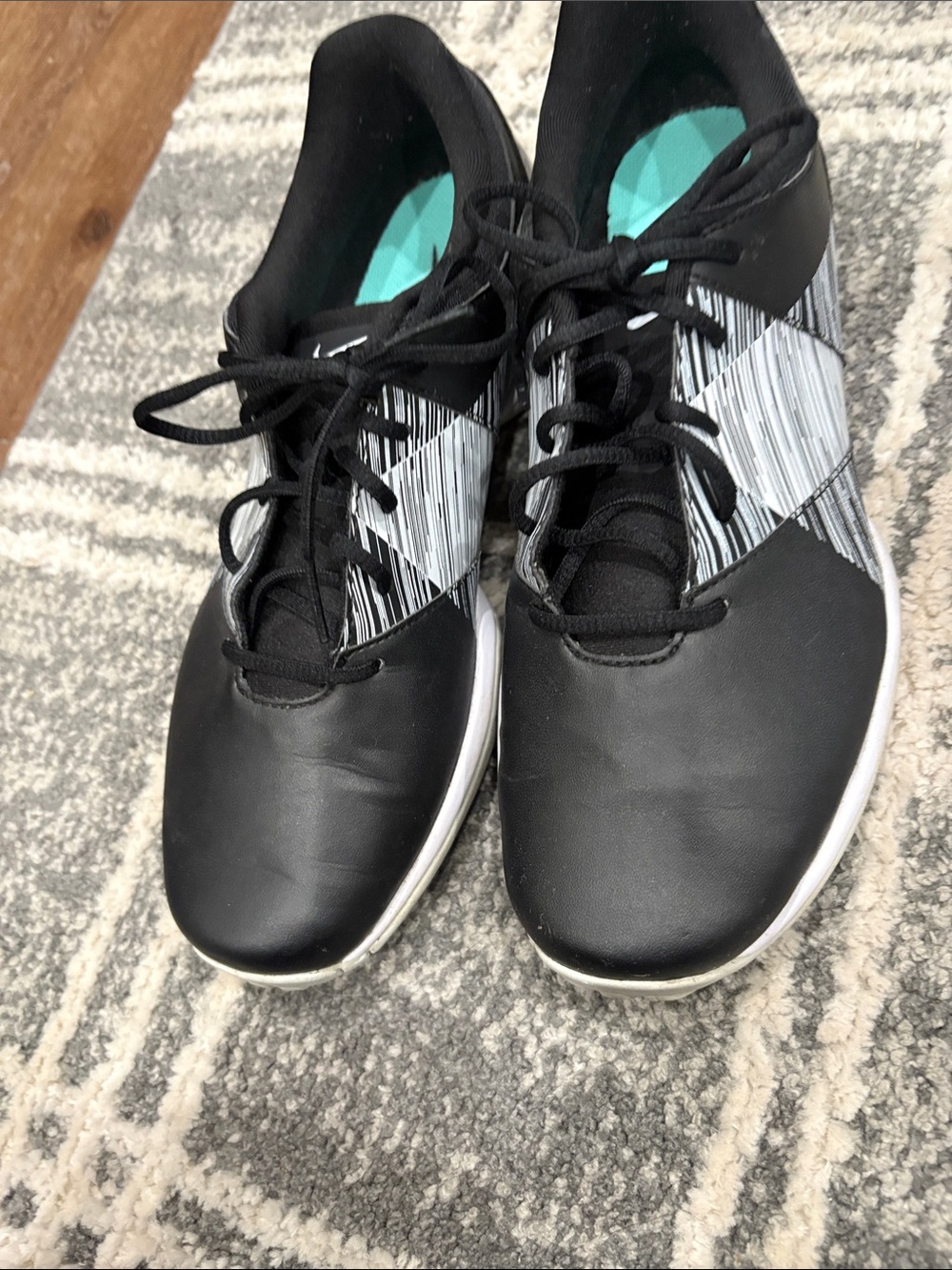 Nike Black Athletic Sneakers with Gray Stripe Pattern